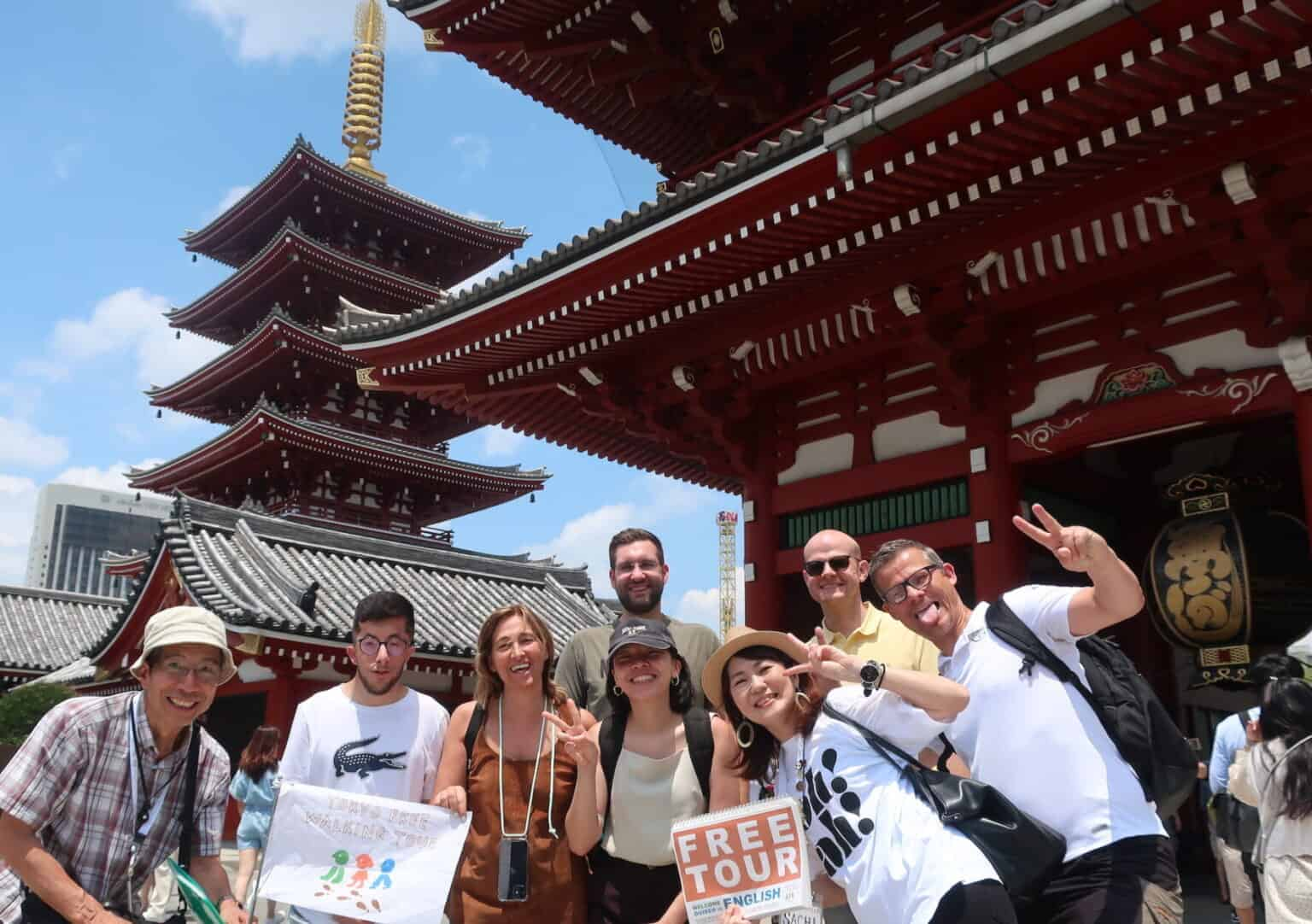 Six guests and two guides at the gate of Sensoji Temple.