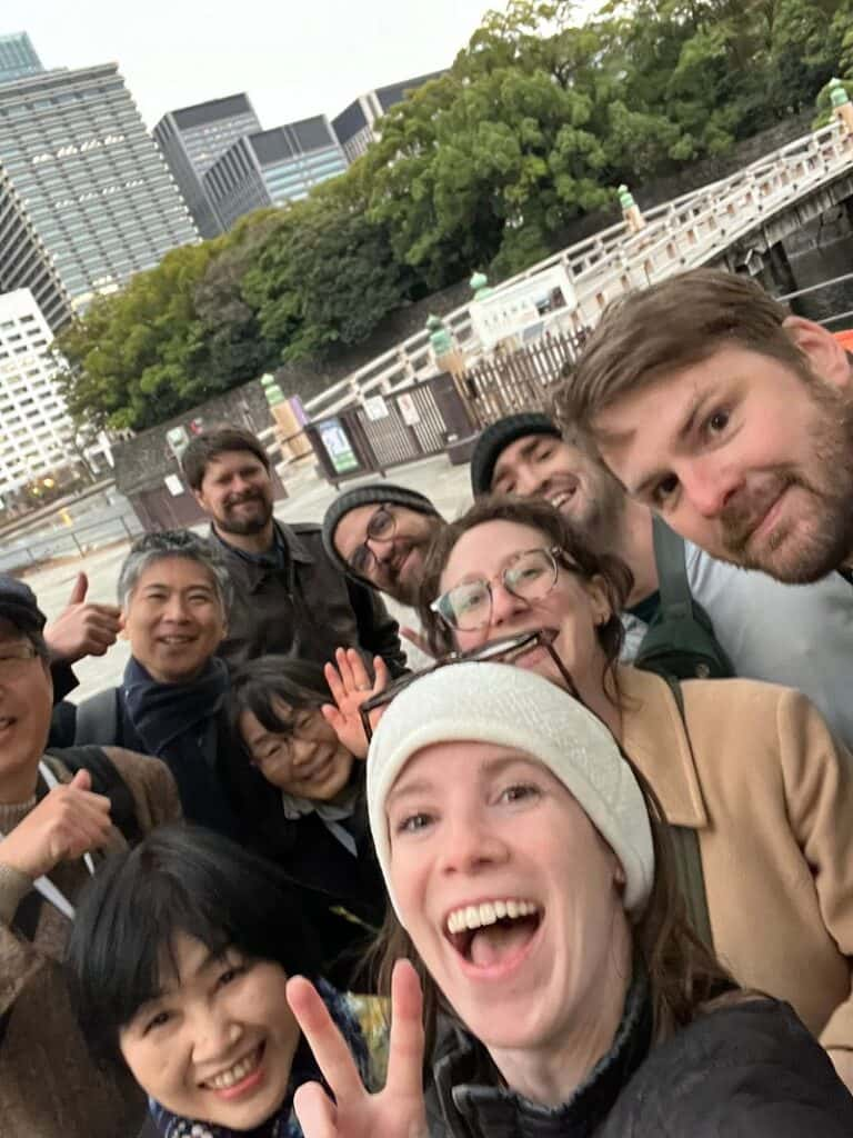 A selfie with all the guests and guides smiling after the tour of Imperial Palace Tokyo