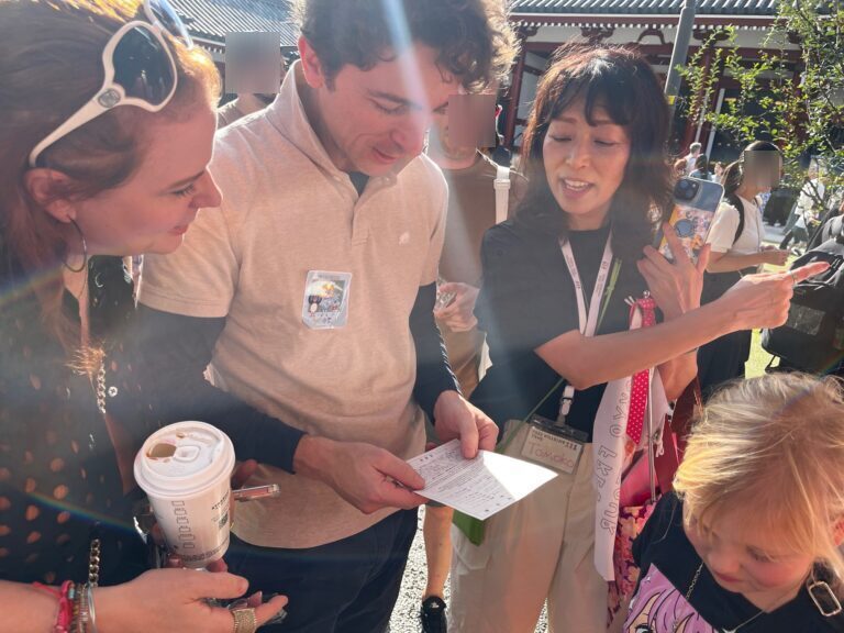 A guide from 'Tokyo Free Walking Tour' is explaining about the fortune telling paper at Sensoji Temple